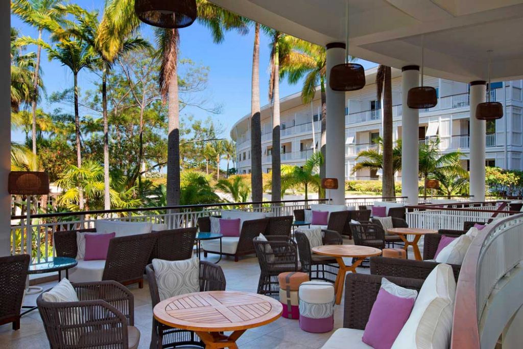 Latitude 22° cafe bar is a nice spot for a drink on the terrace with garden and sea views. (Photo: Marriott)